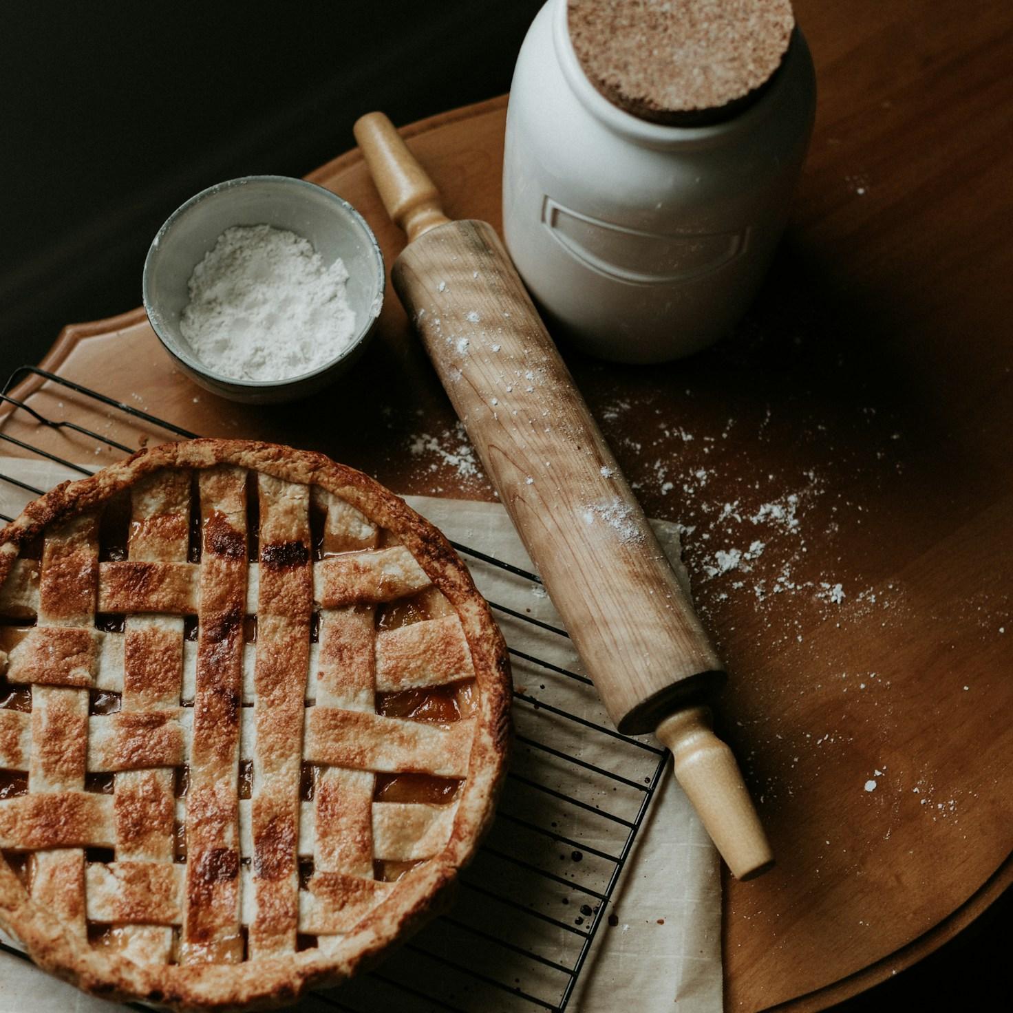 Community members collaborating in a modern kitchen space, sharing recipes and cooking techniques